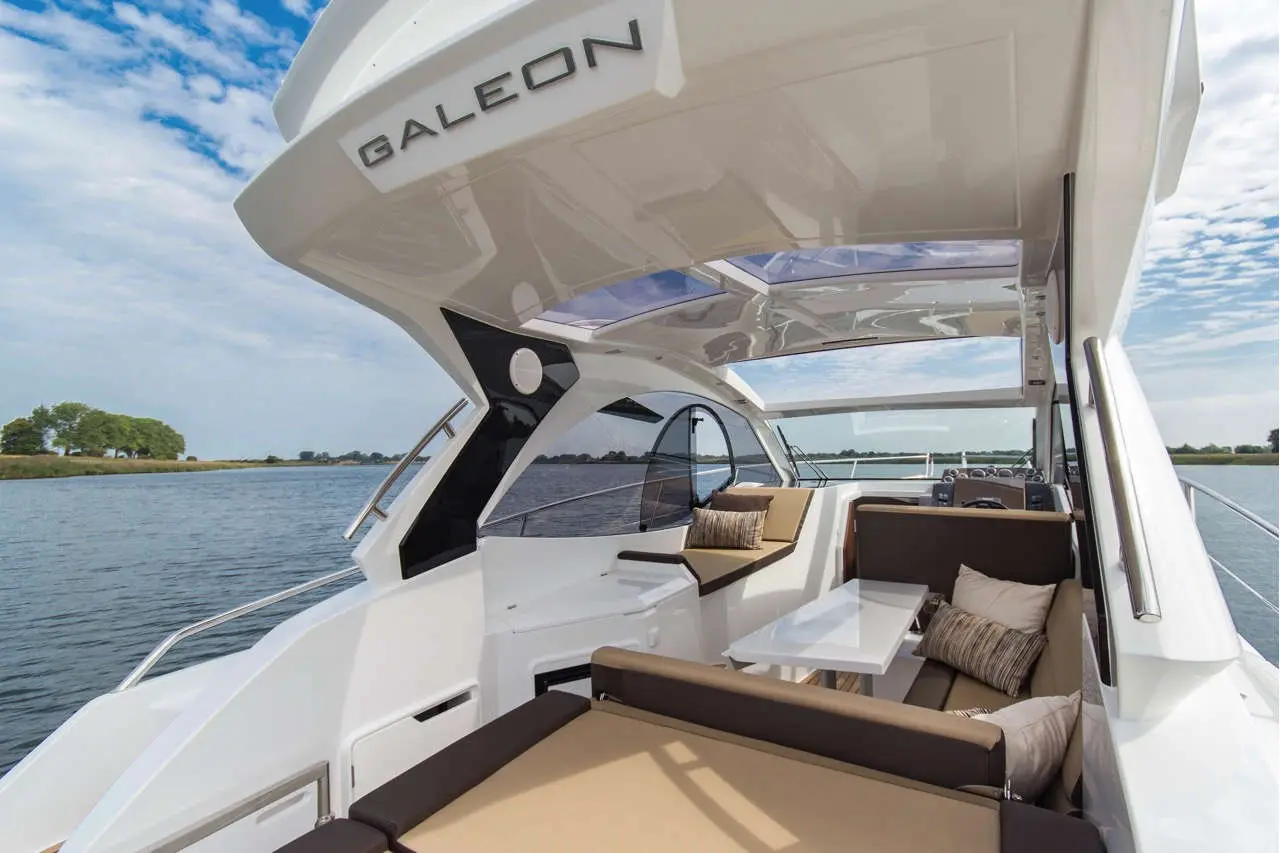Luxury Galeon yacht interior with stylish seating and views of the water and landscape, ideal for relaxation and leisure.
