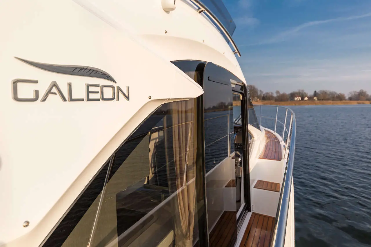Galeon yacht close-up showing the sleek exterior and water view, emphasizing luxury boating and craftsmanship.