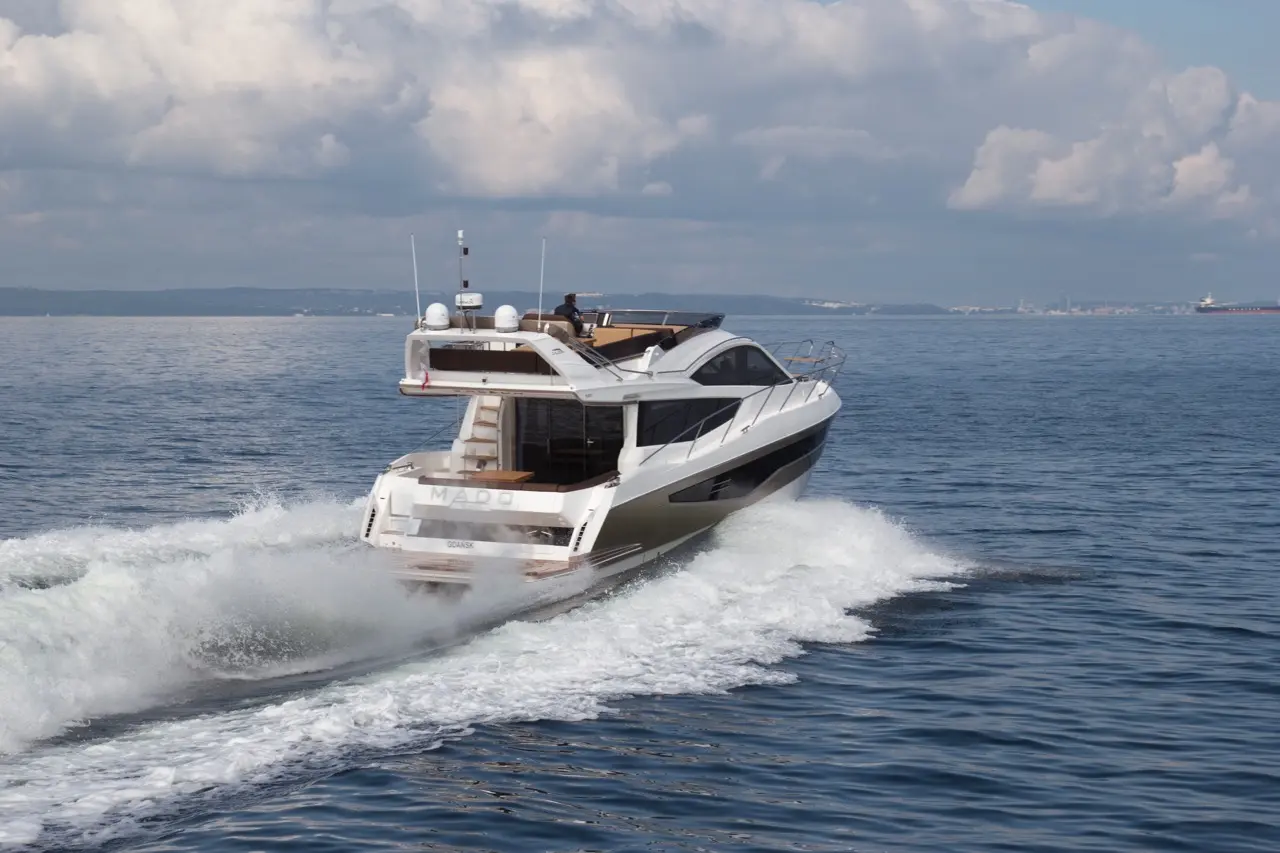 A sleek white motor yacht named 
