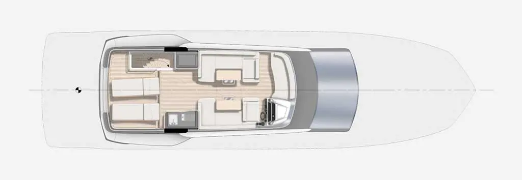 Top view of a yacht interior layout featuring seating areas, table, and helm, with light wood flooring and modern design.