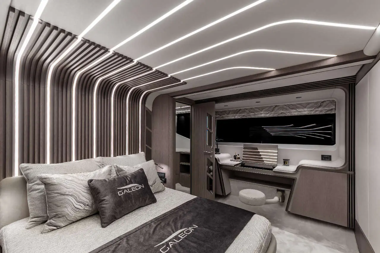 Modern luxury bedroom featuring sleek wooden paneling, ambient lighting, and a neatly made bed with a 'GALEON' pillow.