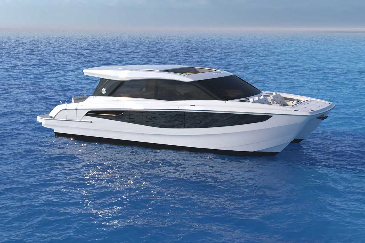 A sleek, modern motorboat with a white and black design is floating on calm blue water.