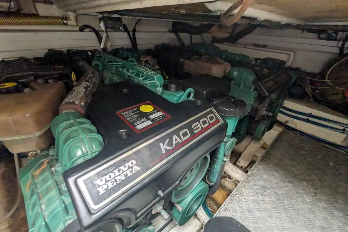 Volvo Penta KAD 300 marine engine displayed in a boat engine compartment, featuring green components and metal surfaces.