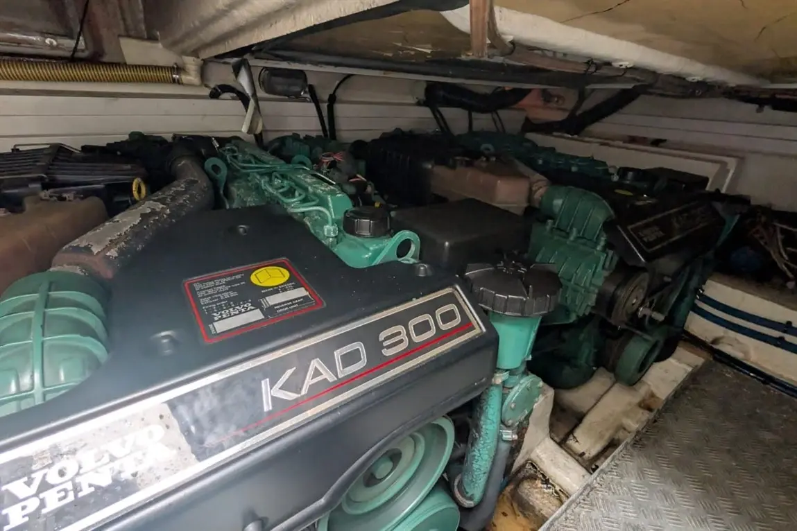 Volvo Penta KAD 300 engines inside a boat's engine compartment, with visible controls and fittings.