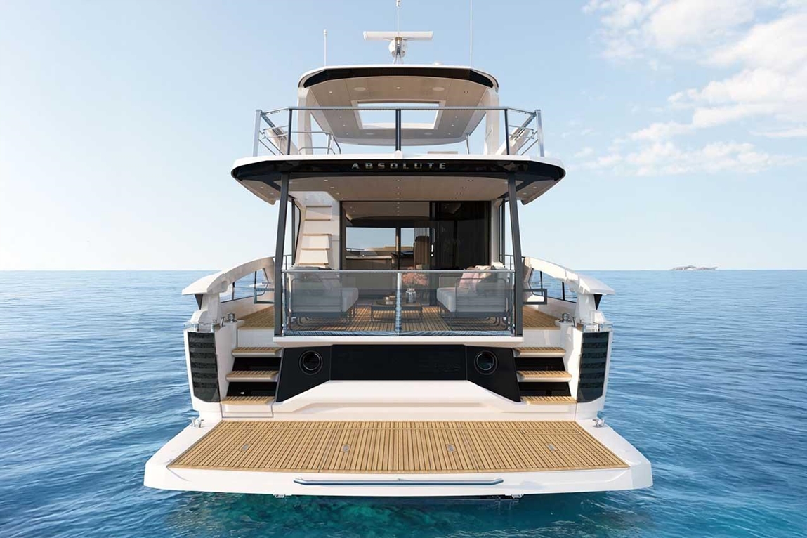 Luxury motor yacht "Absolute" with a spacious deck and tranquil ocean backdrop, featuring lounge seating and stairs.