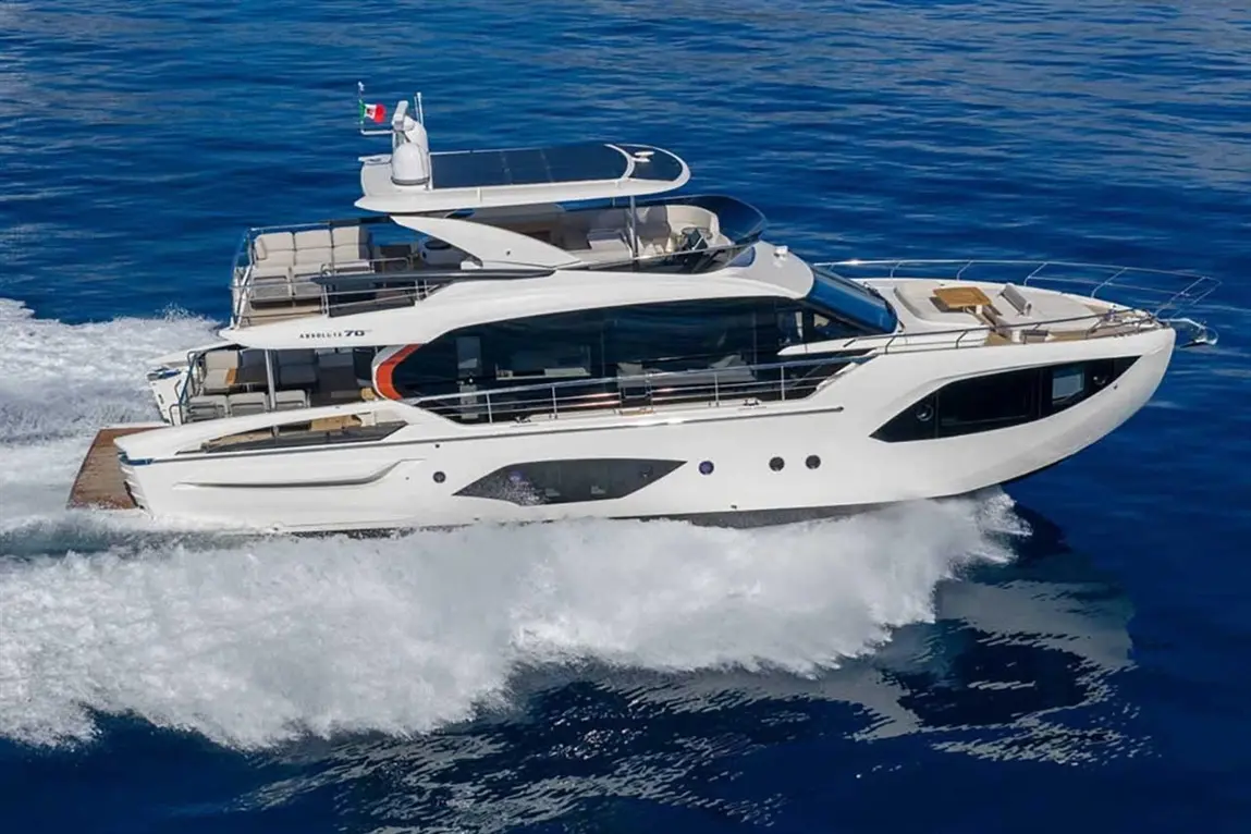 Luxury yacht "Anverali 70" cruising through blue waters, showcasing modern design and spacious deck features.