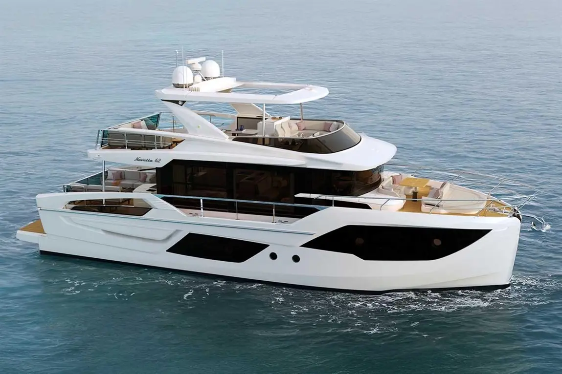 Luxury motor yacht cruising on calm waters, showcasing a sleek white exterior and spacious deck seating area.