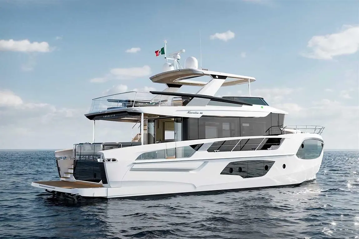 Luxury yacht Navigare 66, featuring sleek lines and a wooden deck, anchored on calm waters under a clear sky.