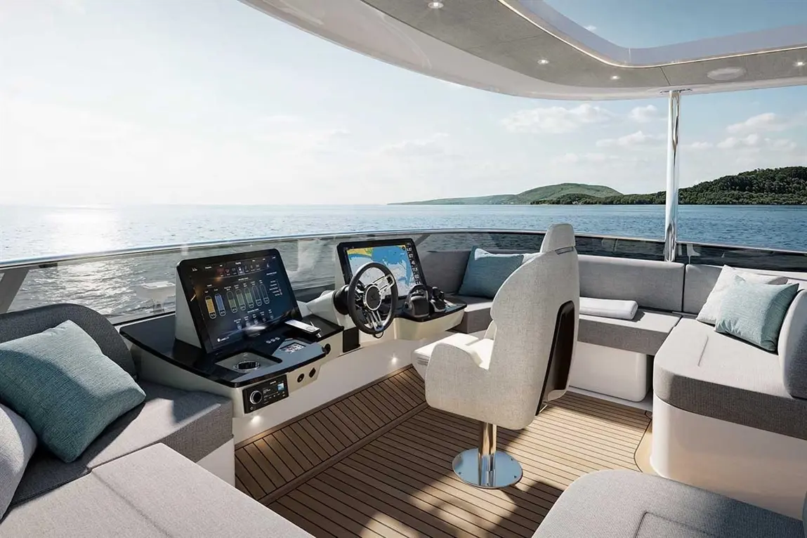 Luxury motor yacht cockpit with modern controls, plush seating, sea view, and spacious layout for comfort and navigation.