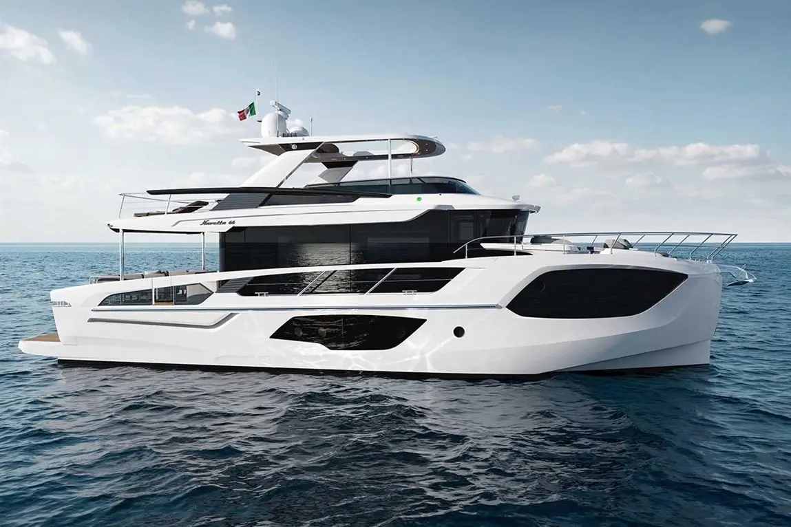 Luxury yacht model Navetta 68, featuring a sleek white exterior and docked in calm waters under a blue sky.