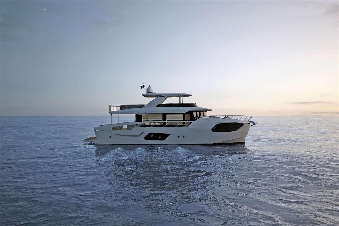 Luxury motor yacht cruising on calm waters at sunset, showcasing sleek design and elegant features.