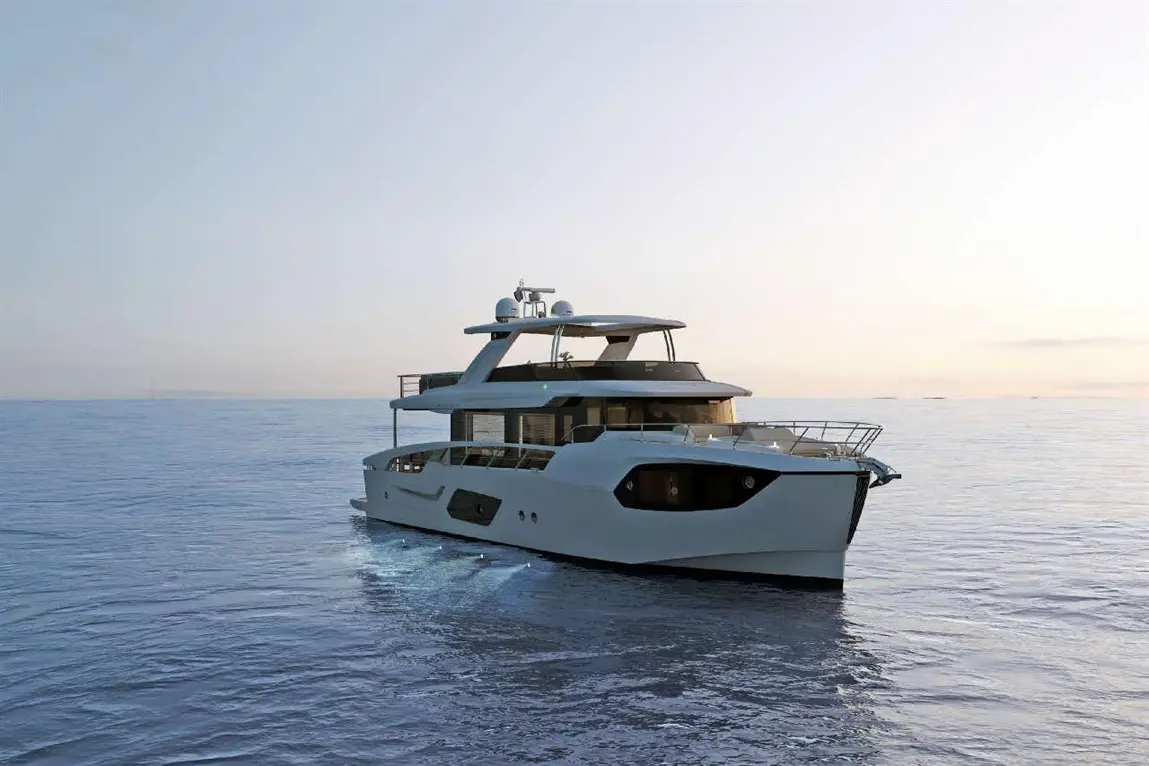 A luxurious white yacht glides through calm waters at sunset, showcasing a sleek design and modern features.