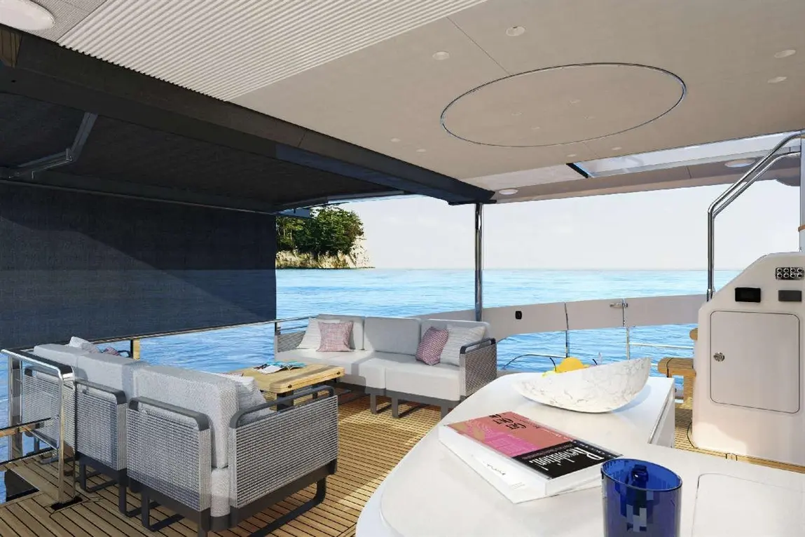 Luxurious boat deck featuring modern seating, a wooden table, decorative bowl, and scenic ocean view.