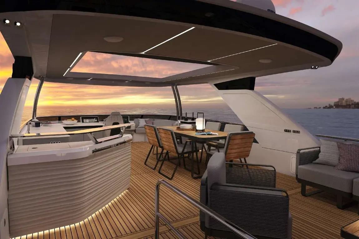 Luxury yacht interior with modern furnishings, dining table, and sunset view over the ocean. Relaxing outdoor seating area.