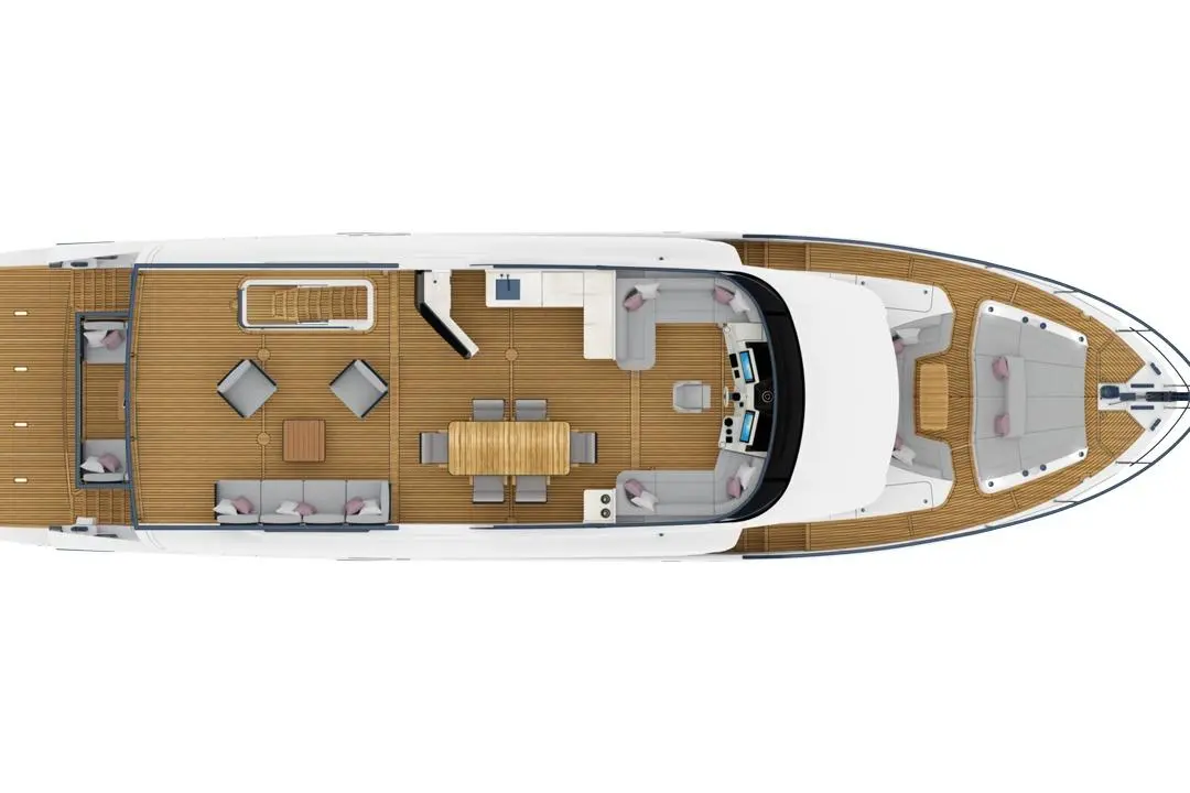 Top view of a yacht deck featuring a dining table, lounge areas, and a modern helm with multiple seating options.