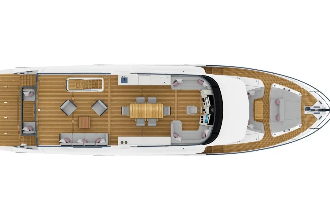 Top view of a modern yacht featuring a spacious deck with seating areas and dining table, surrounded by polished wooden flooring.