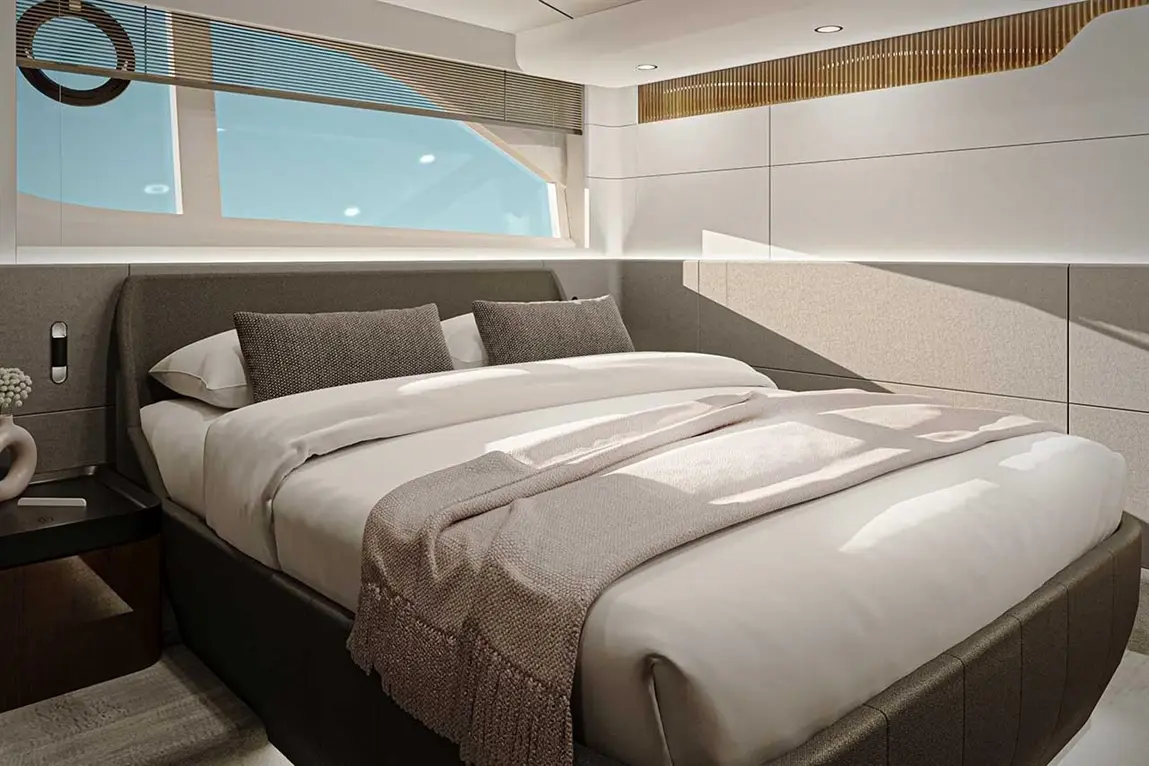A sleek bedroom featuring a double bed with plush pillows, a soft throw, and large windows providing natural light.