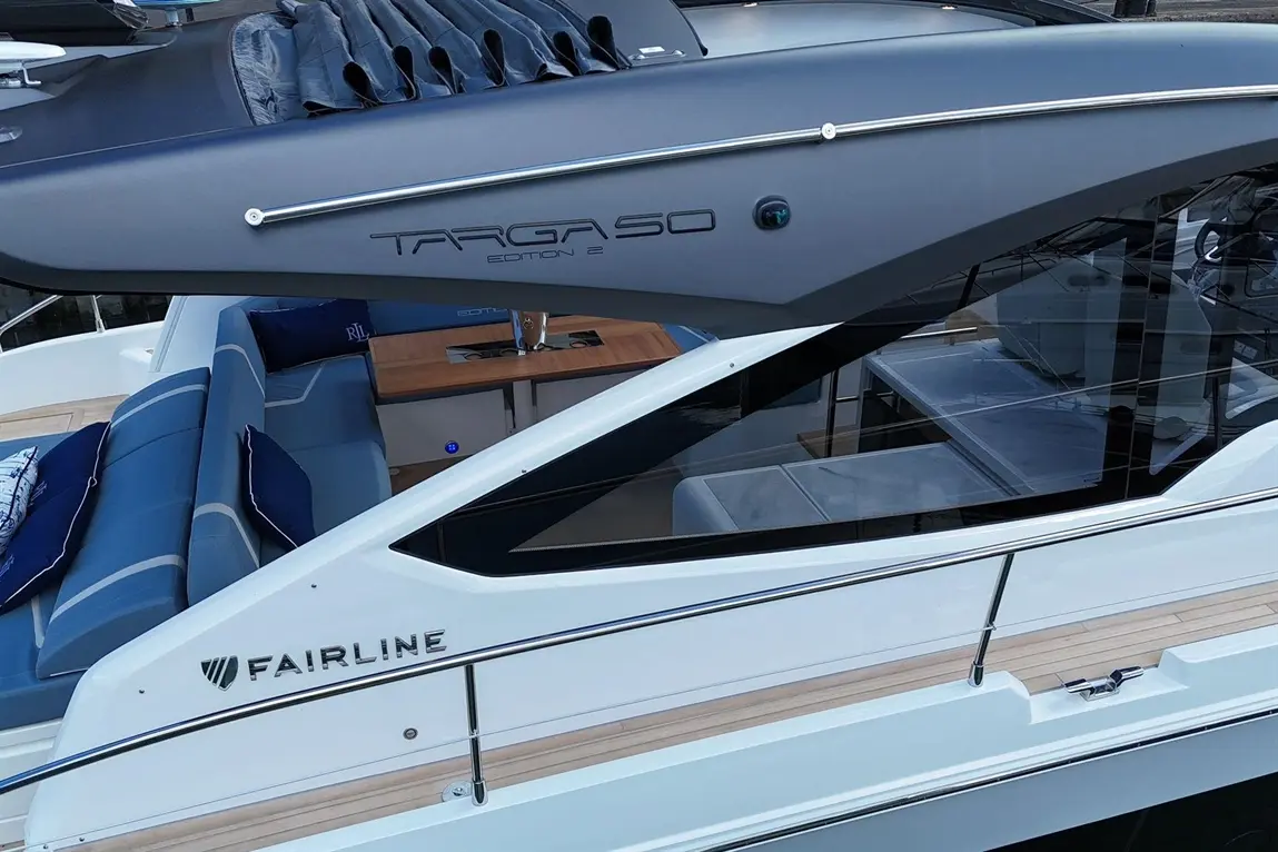A close-up of the Fairline Targa 50 Edition 2 yacht, showcasing sleek design, cushioned seating, and stylish interior.