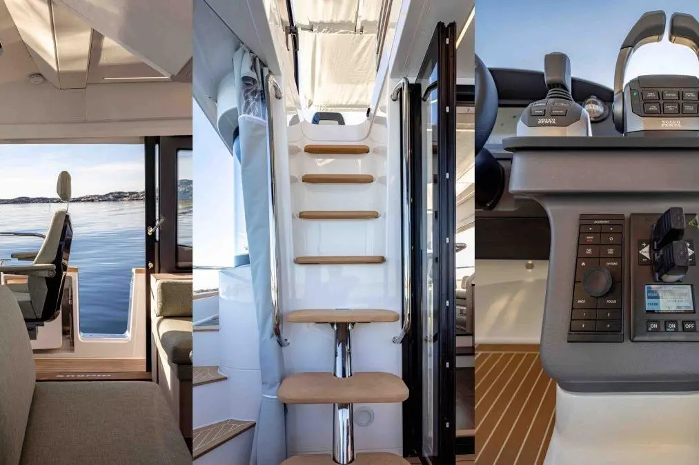 Interior of a yacht showcasing a steering area, a staircase with wooden steps, and a view of calm waters through windows.