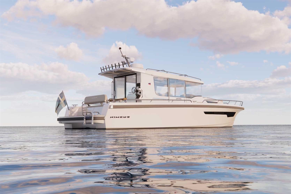 A Nimbus boat is anchored on calm water under a blue sky with clouds, showcasing its sleek design and modern features.