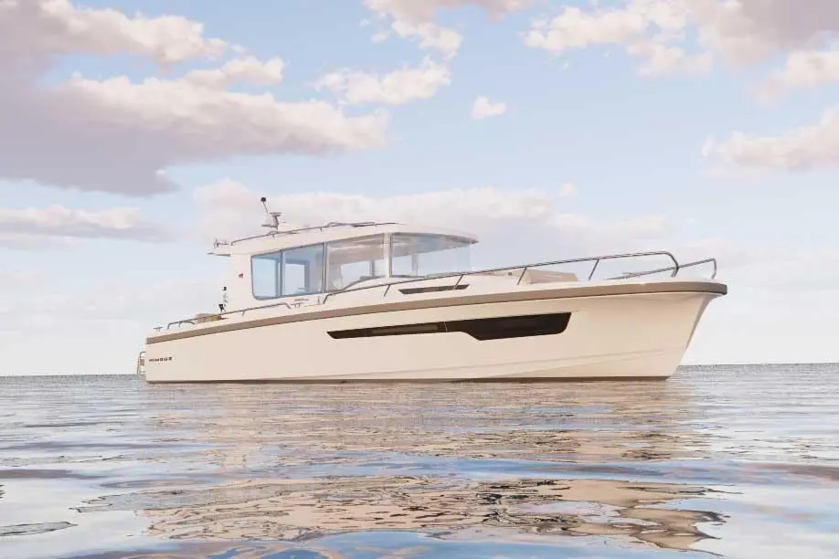 A sleek motorboat with a cabin is anchored on calm waters under a clear sky, surrounded by soft clouds.