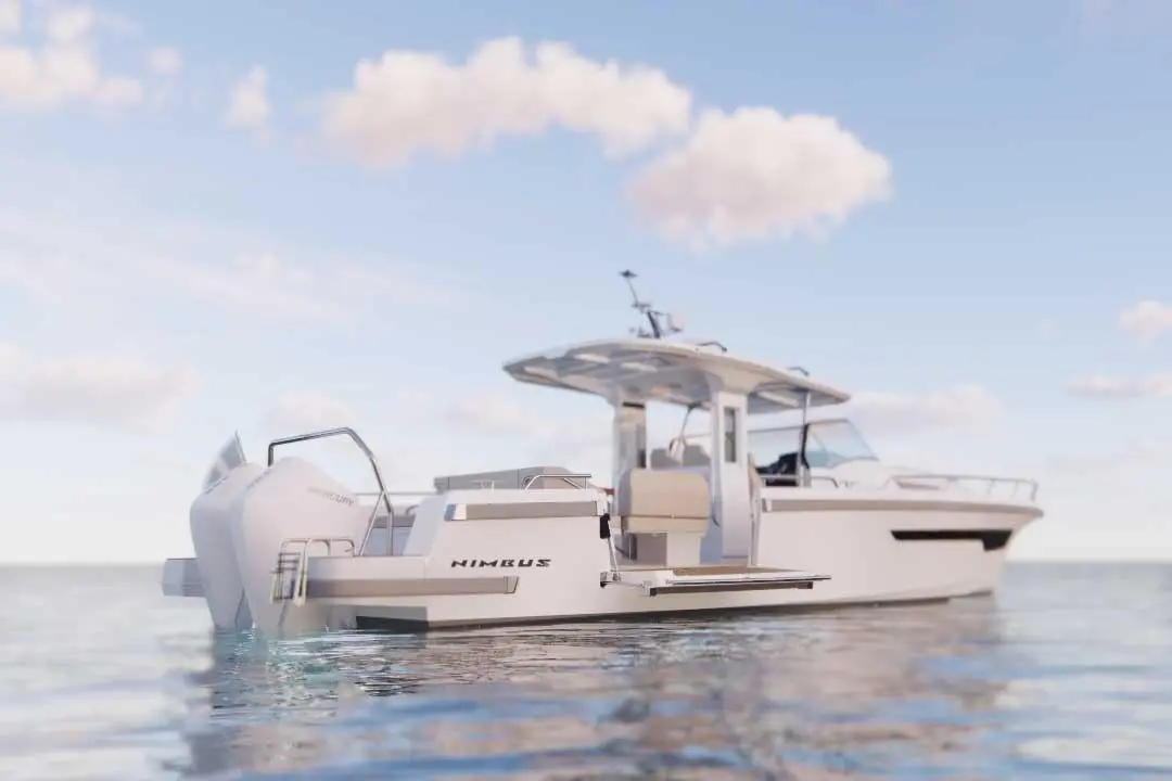 A Nimbus boat anchored in clear water, featuring a sleek design, white hull, and spacious seating area under a canopy.