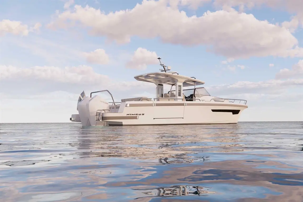 A sleek Nimbus motorboat floats on calm water, under a blue sky with clouds, showcasing modern design and luxury features.