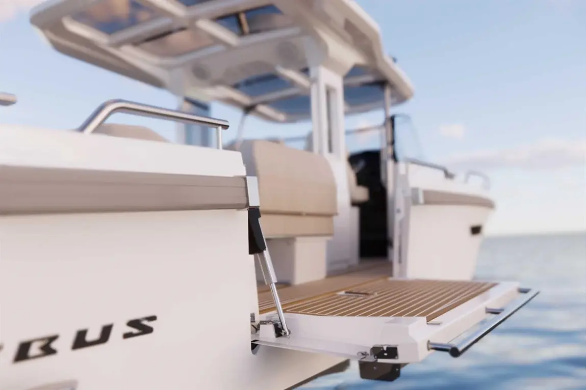 A close-up of a boat's rear platform with a wooden deck and stainless steel railing against a serene water background.