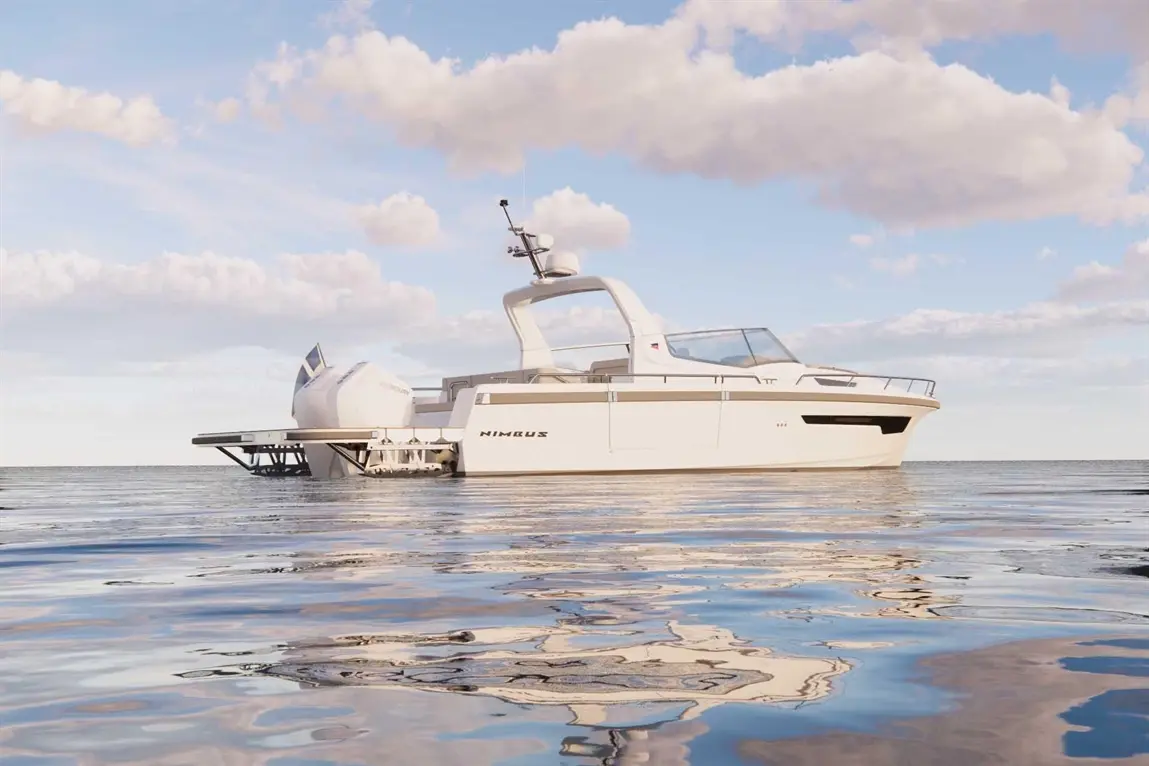 A sleek Nimbus boat anchored in calm waters under a blue sky with clouds, reflecting shimmering light on the surface.