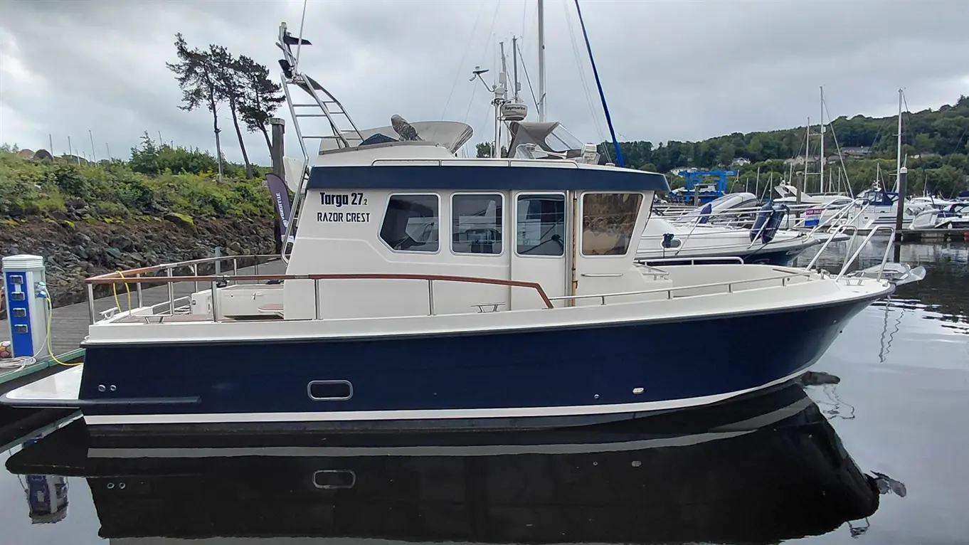 A blue and white Targa 27.2 boat named 
