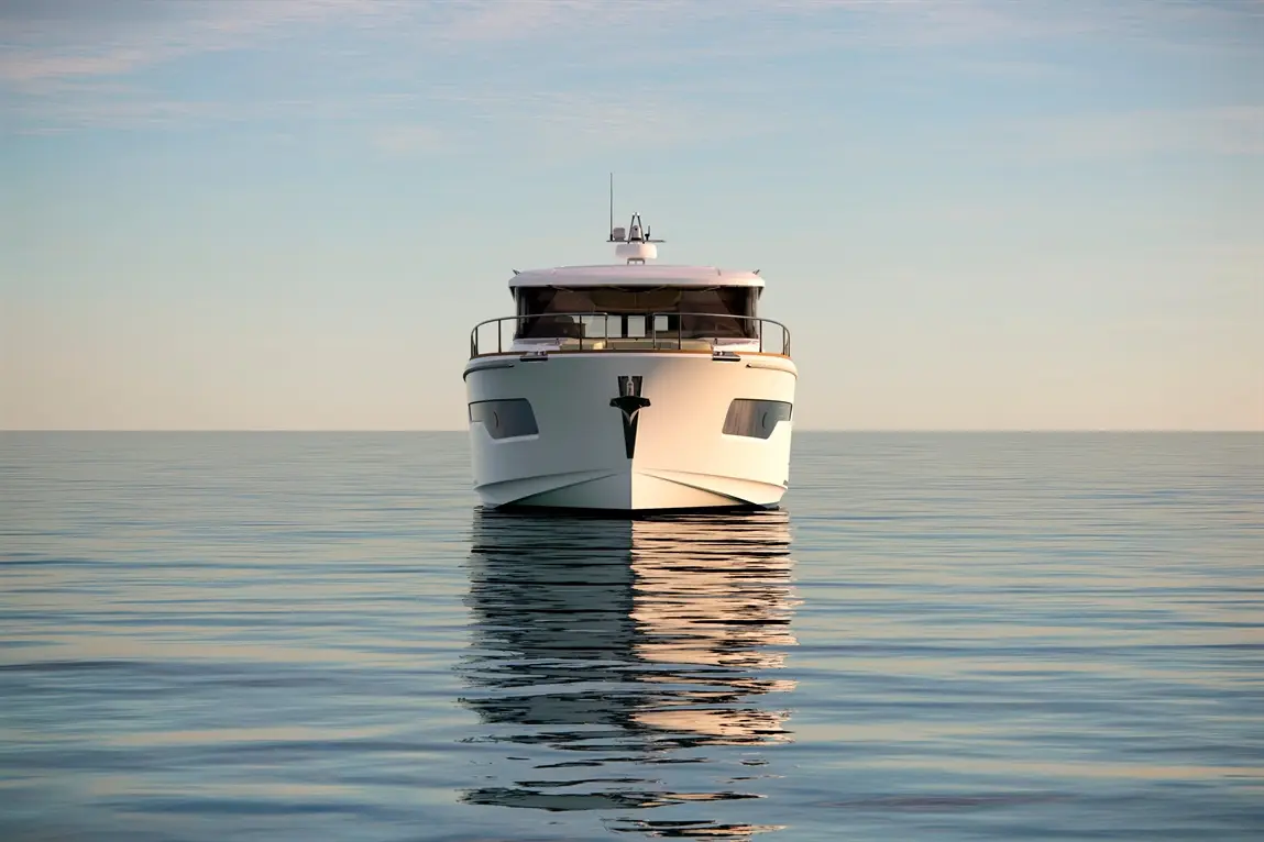 A sleek white yacht reflecting on calm water under a clear sky, emphasising luxury and tranquility at sea.