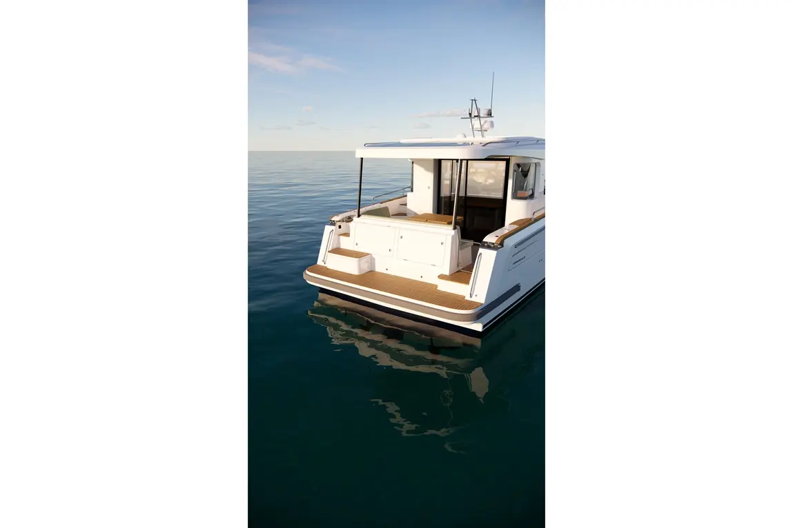 A modern white boat with wood decking is anchored on calm blue waters, reflecting the sky and surrounding scenery.