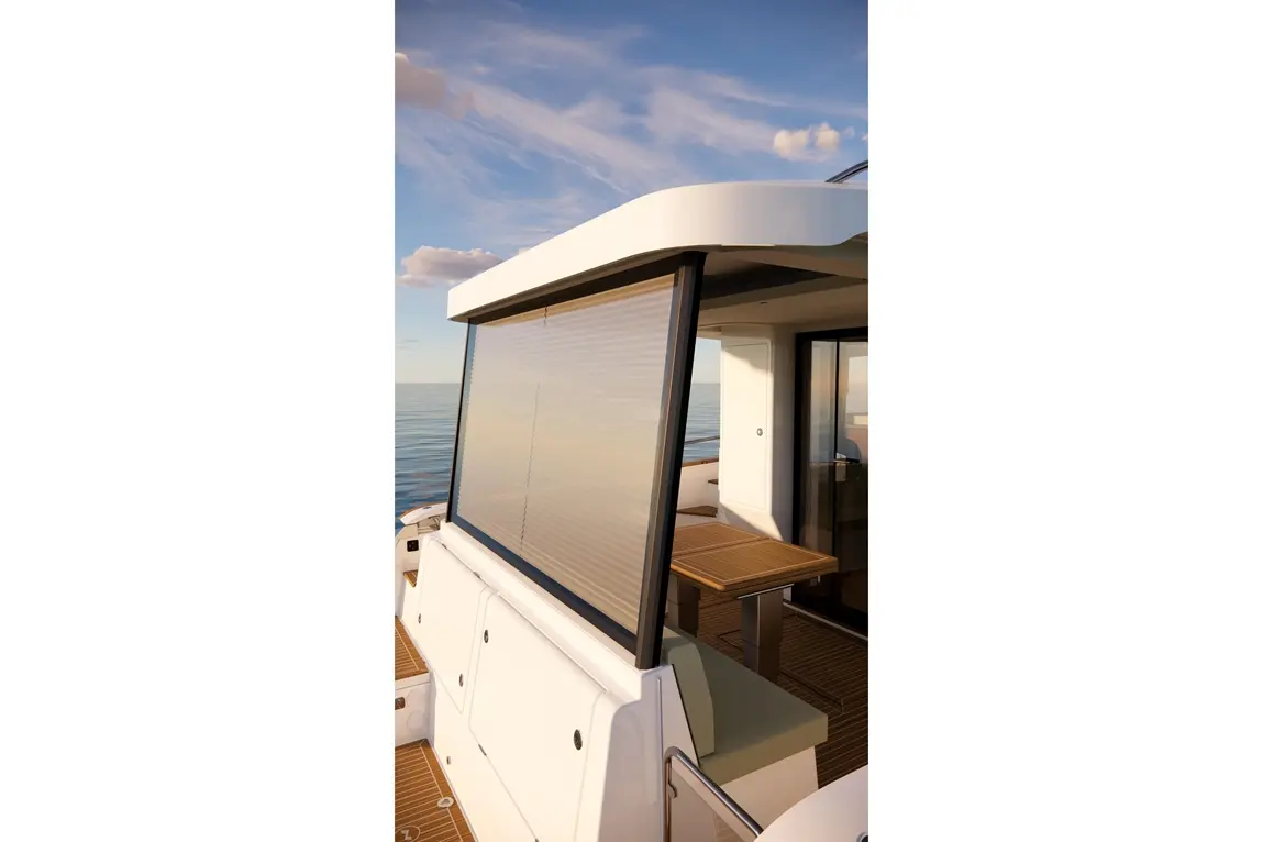 A sleek boat cockpit features a retractable blind, stylish furnishings, and expansive views of calm waters.