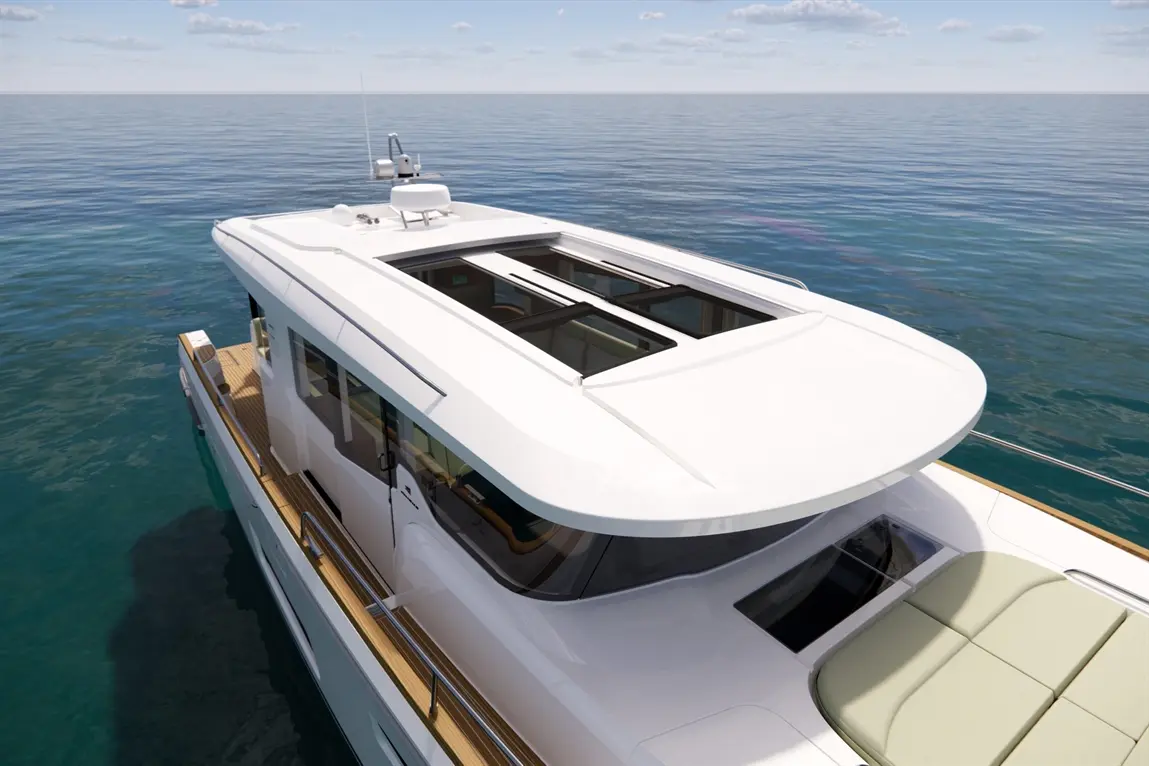 Beach yacht deck view with large sunroof and plush seating area against a serene ocean backdrop.