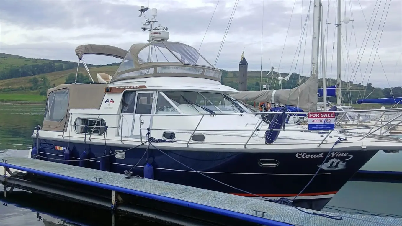 Nimbus 380 Commander motorboat “Cloud Nine” moored at a marina, displaying a “For Sale” sign.