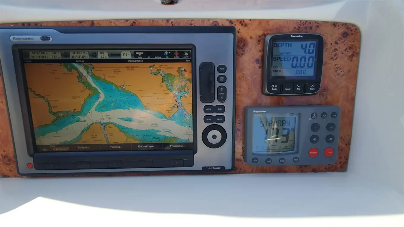 Raymarine navigation display showing a waterway map with depth 4.0m and speed 0.00 knots on a boat dashboard.