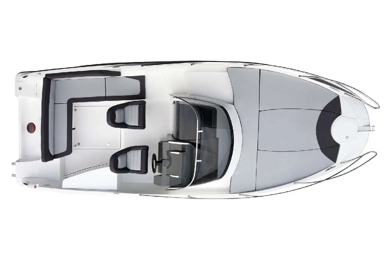 Top view of a sleek, modern boat featuring grey and black seating, a helm, and a spacious deck area.