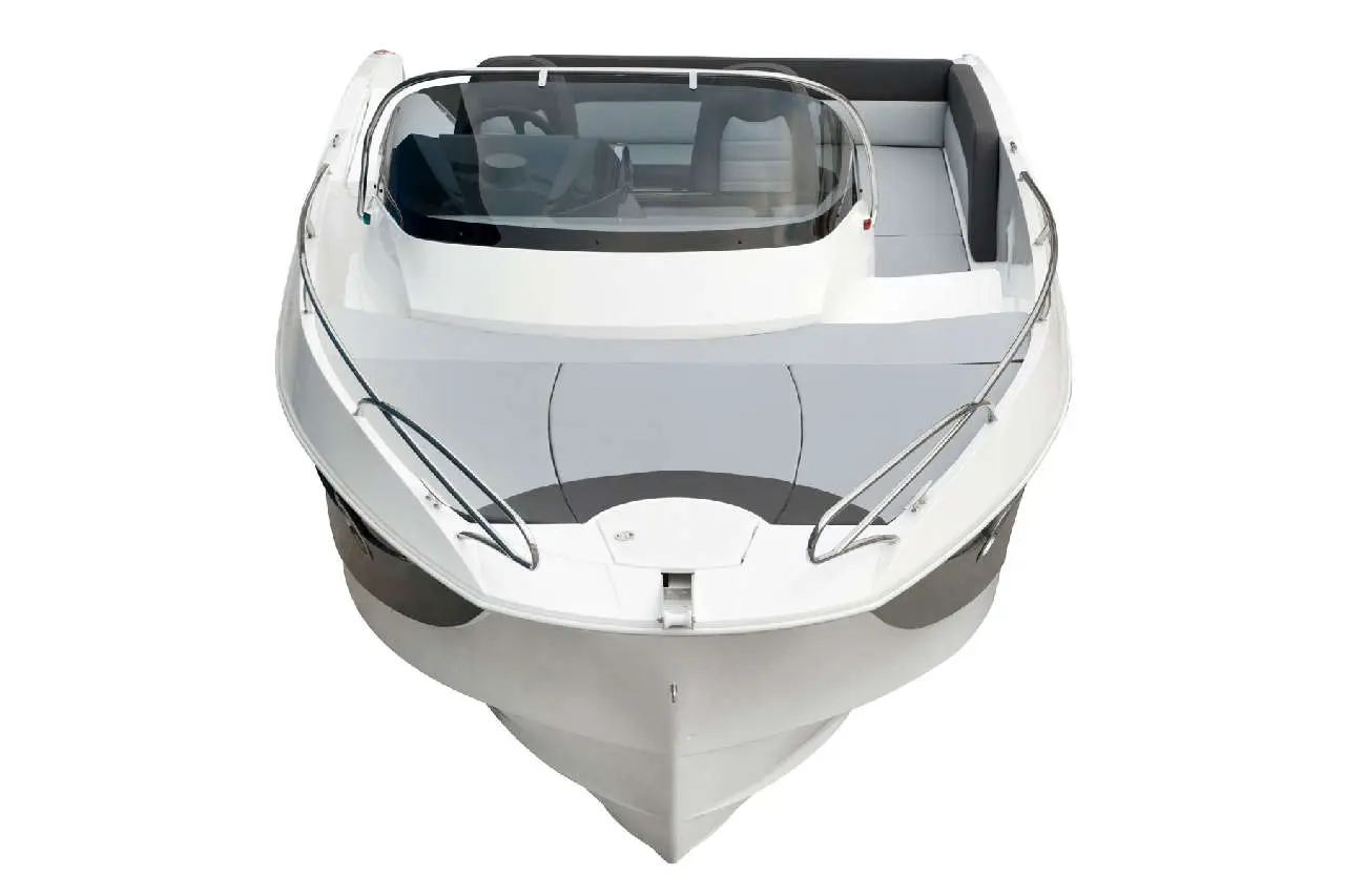 Modern white motorboat viewed from the front, featuring a sleek design and grey seating area.